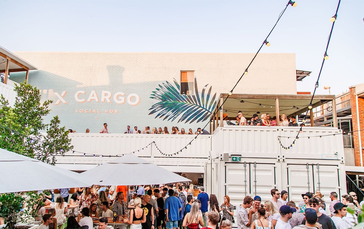 an outdoor bar filled with people